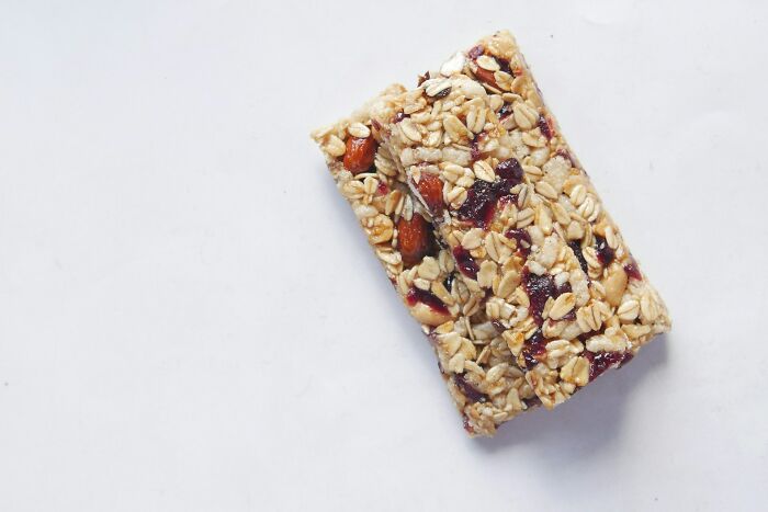 Close-up of two granola bars with nuts and dried fruit, symbolizing energy for sharing near-death experiences stories.
