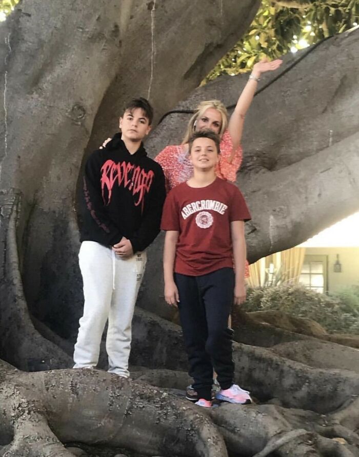 Kevin Federline with sons outdoors near large tree, highlighting claims involving Britney Spears and their children. Kevin Federline with sons outdoors near large tree, highlighting claims involving Britney Spears and their children.