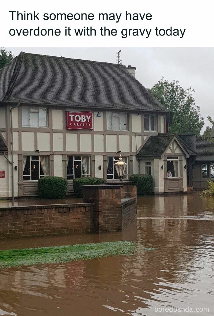 Flooded Toby Carvery building humorously captioned as having overdone it with gravy, reflecting unapologetically British memes.