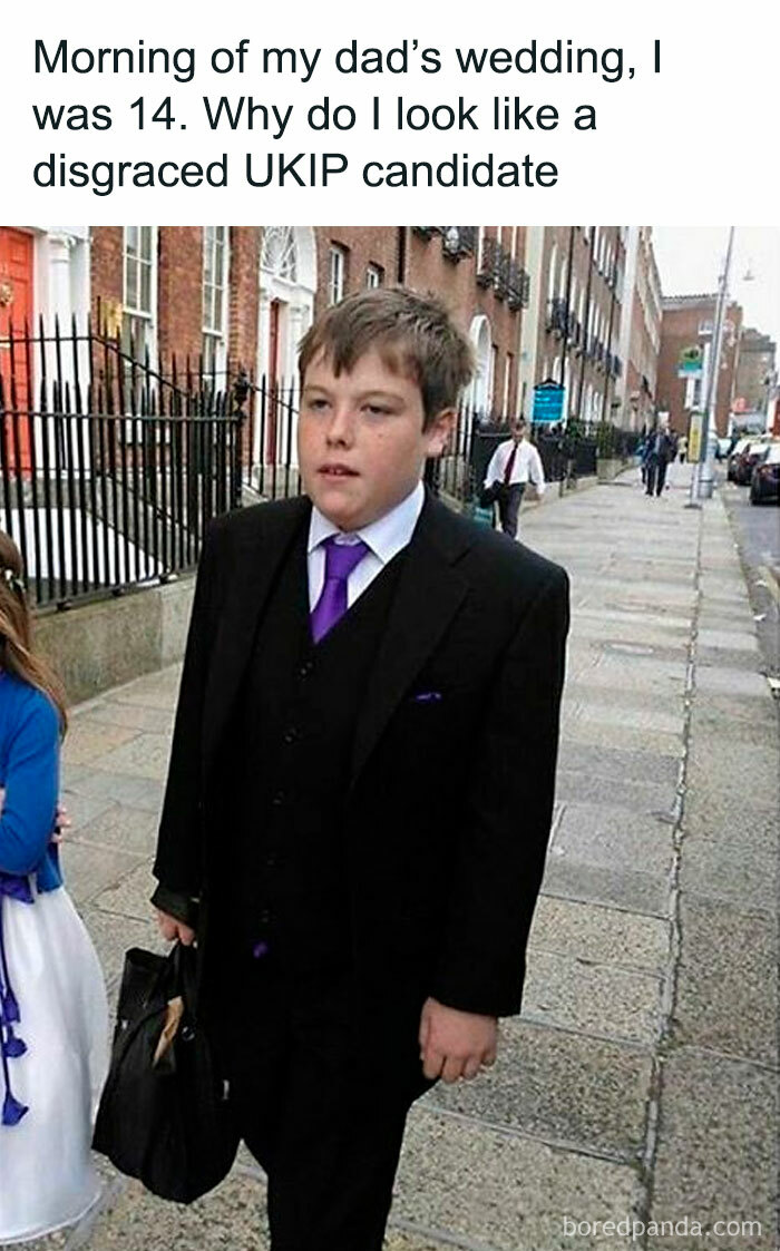 Teen boy in a suit and purple tie walking on a British street, part of unapologetically British memes and posts.