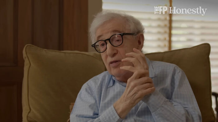 Elderly man wearing glasses and a blue shirt sharing stories about the longest grudges people have ever held.