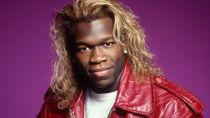 Portrait of a man with long blonde hair wearing a red leather jacket, representing hard rock cover of 50 Cent's Many Men.