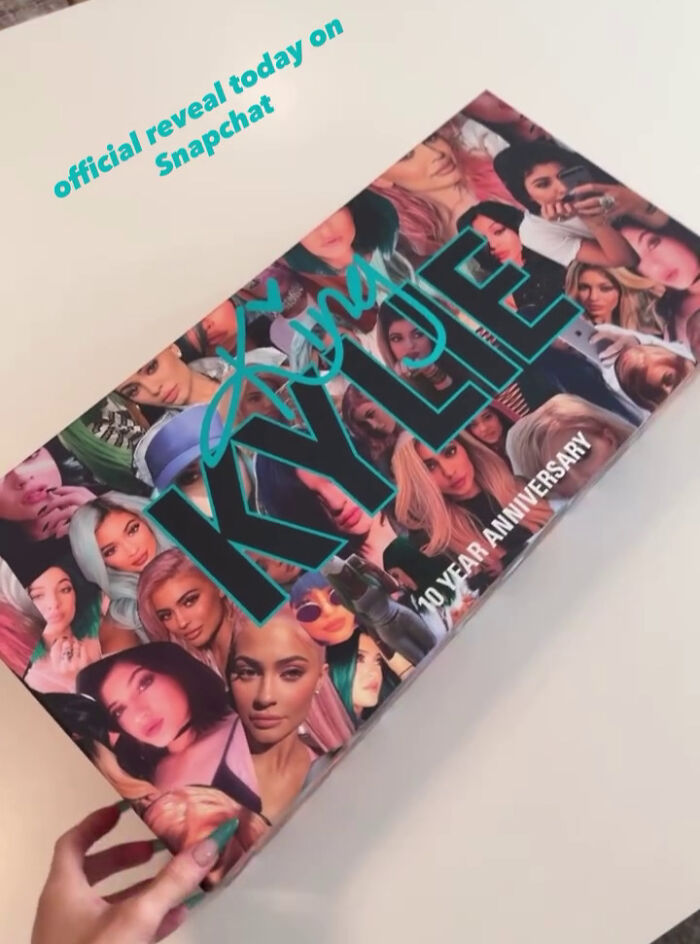 Kylie Jenner cosmetics box with collage of her images and text about official reveal on Snapchat, highlighting privilege showing controversy.