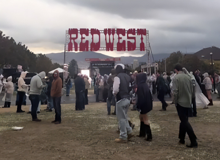 Crowd at Red West music festival as attendees gather despite cloudy weather before the tragic freak accident involving a woman.