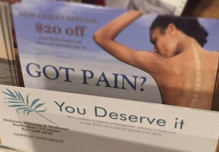 Pamphlet showing back pain relief options with a spine highlighted and a $20 off coupon for massage services.