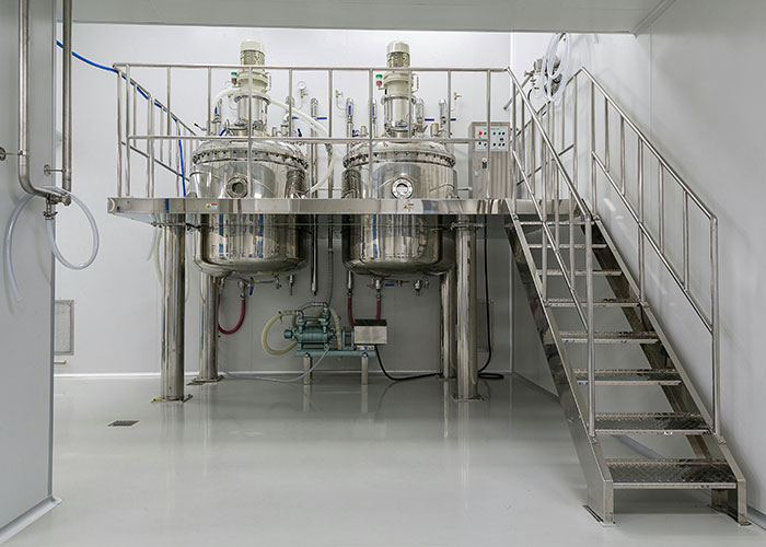 Stainless steel industrial tanks and equipment in a clean facility related to medical examinations uncovering death truths.
