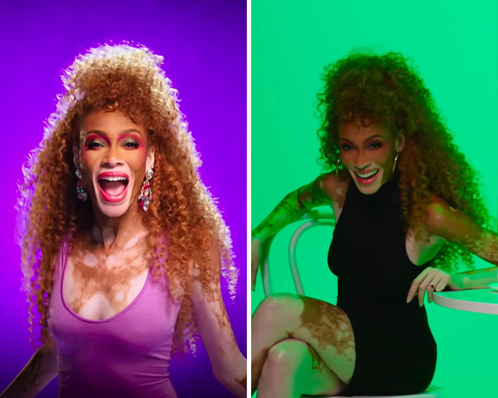 Winnie Harlow with curly hair and vibrant makeup posing in colorful lighting amid backlash for channeling Whitney Houston.