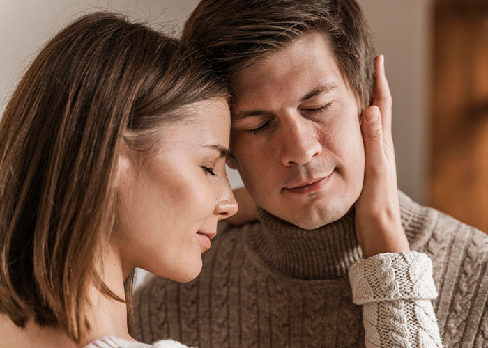 A close-up of a man and woman sharing a tender moment, illustrating myths about men and emotions debunked.