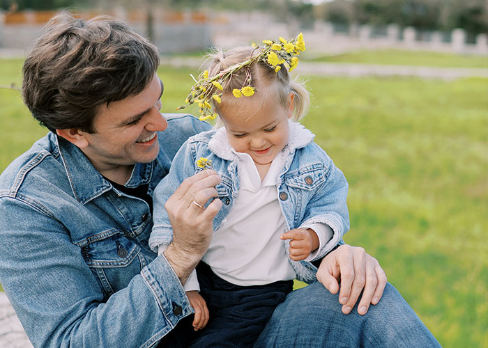 Man and child in denim jackets enjoying time outdoors, illustrating men share myths about them that are simply not true.
