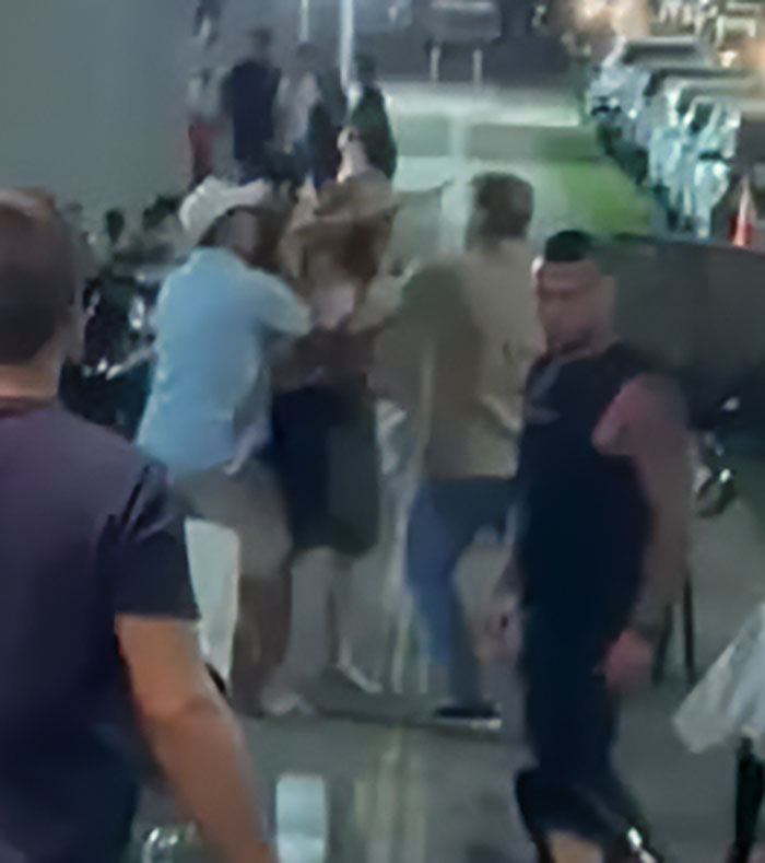 Man and woman involved in a heated street altercation as children come first in a viral debate incident.