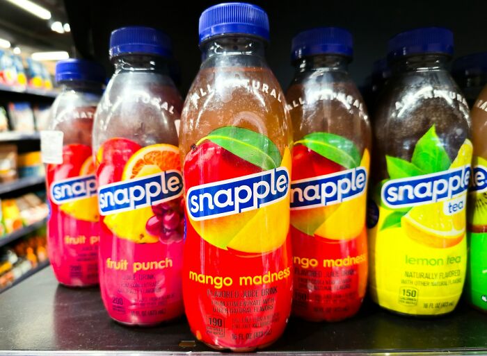 Bottles of Snapple drinks on a store shelf illustrating people’s longest grudges and why they couldn’t let go.