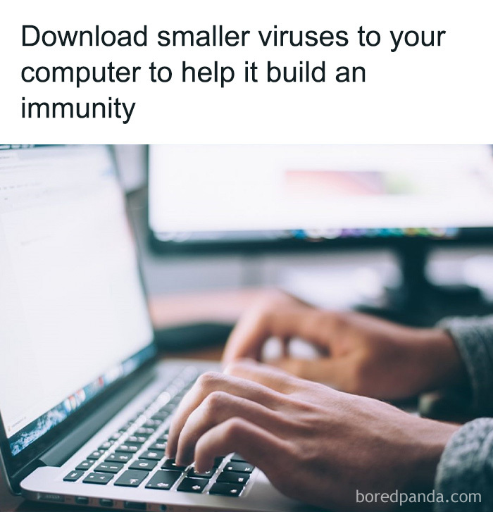 Hands typing on a laptop keyboard with a humorous educational meme about downloading smaller viruses for immunity.