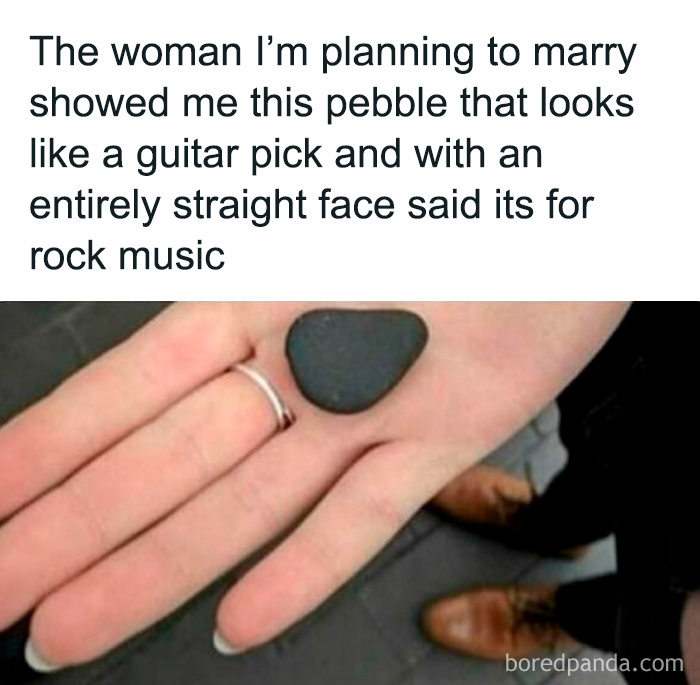 Hand holding a pebble that looks like a guitar pick with funny text about rock music meme humor.