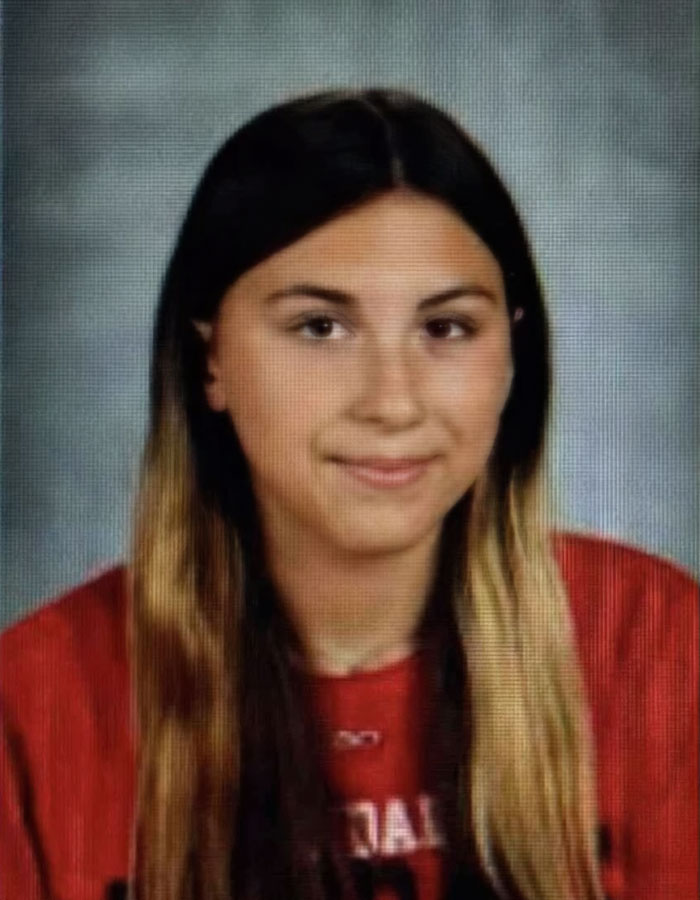 Portrait of a teenage girl with long hair wearing a red shirt, related to step-uncle arrested after body found in RV. Portrait of a teenage girl with long hair wearing a red shirt, related to step-uncle arrested after body found in RV.