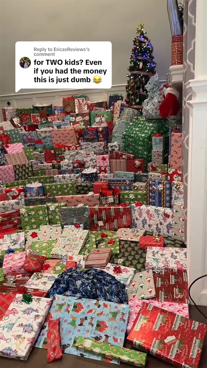 Room filled with an insane amount of gifts for kids, highlighting consumerism backlash during the holiday season.