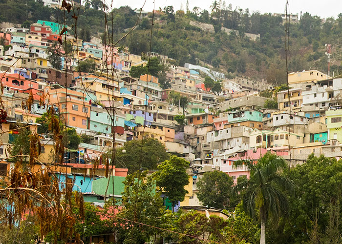 Colorful densely packed houses on a hillside in one of the worst cities worldwide you should never visit.