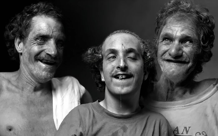 Three men from America&rsquo;s most inbred family posing together, showing unique facial features in a black and white photo.