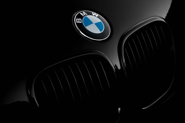 Close-up of a black BMW car grille and logo, illustrating stories about people who don’t deserve nice things.