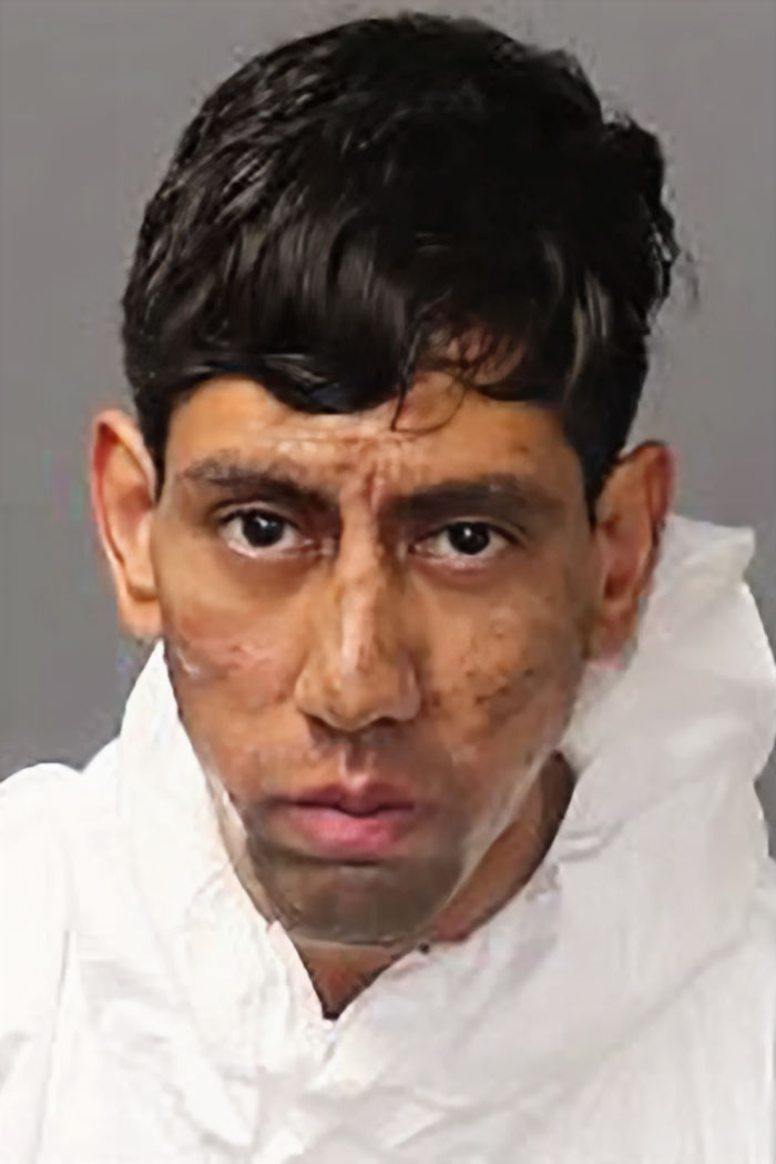 Man accused of taking two lives wearing white protective suit, linked to Kafka and cockroach claim in tragic case