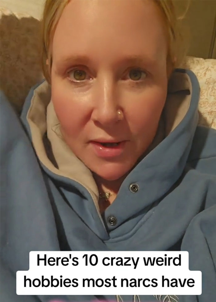 Woman wearing a blue hoodie discussing red flags that could mean someone is a narcissist in a casual setting. Woman wearing a blue hoodie discussing red flags that could mean someone is a narcissist in a casual setting.