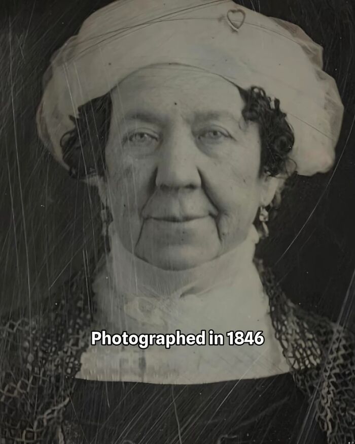 Older woman born in the 1700s wearing a white bonnet and vintage clothing, photographed in 1846 early photography. Older woman born in the 1700s wearing a white bonnet and vintage clothing, photographed in 1846 early photography.