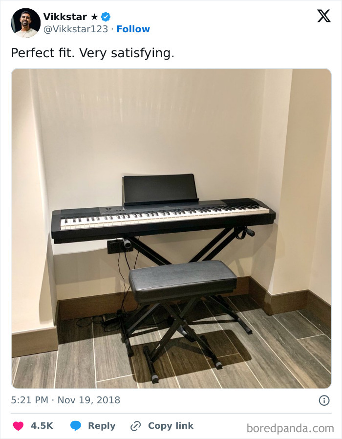 Digital piano and bench perfectly aligned in corner, showcasing satisfying and precise arrangement that intrigues and delights viewers.