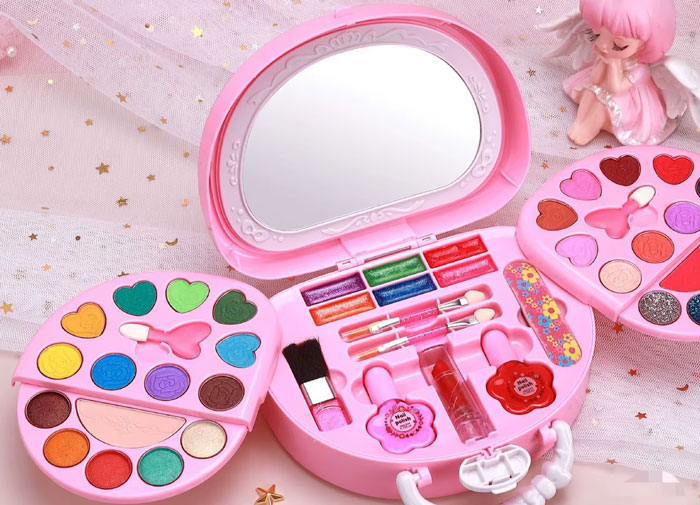 Pink makeup kit with colorful eyeshadows, lip gloss, brushes, and heart-shaped palettes representing I hate people sometimes stories.