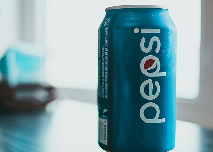 Blue Pepsi can placed on a table, one of the fascinating items people found in the walls of their homes.