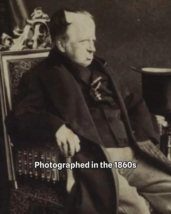 Elderly man from the 1700s seated in a vintage chair, wearing dark formal attire, captured in early photography style. Elderly man from the 1700s seated in a vintage chair, wearing dark formal attire, captured in early photography style.