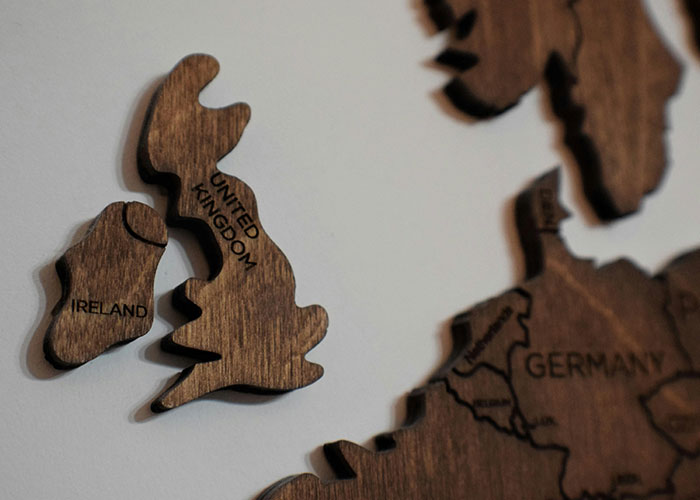 Wooden map pieces showing United Kingdom and Ireland, illustrating common knowledge that often surprises people.