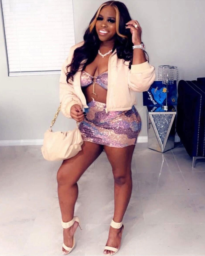 Woman posing indoors wearing a pastel outfit and high heels, representing women who had a BBL and faced tragic consequences.