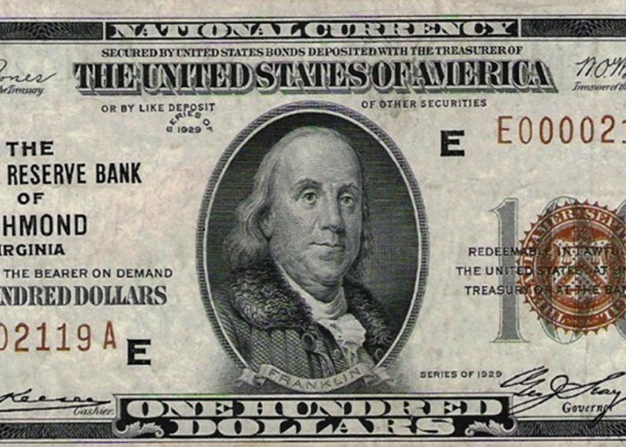 Close-up of a rare 1929 one hundred dollar bill found hidden in the walls of a home as a fascinating item discovery