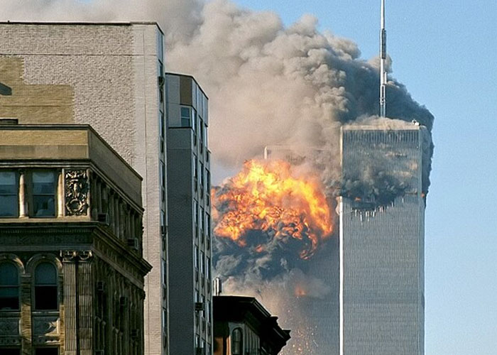 Explosion and smoke billowing from a high-rise building, illustrating one of the most terrifying things found online.