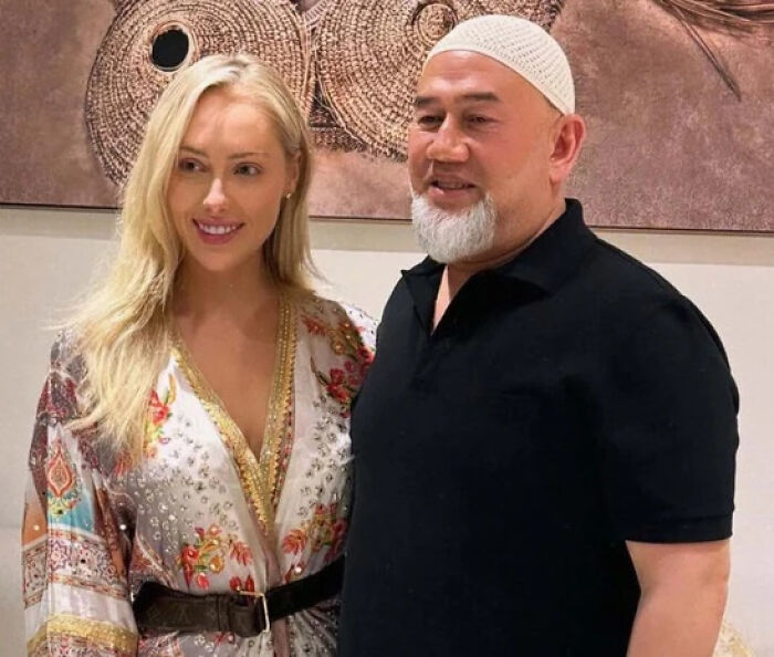 Singer with Malaysia&rsquo;s ex-king posing together indoors, highlighting the accidental marriage and divorce demand situation.