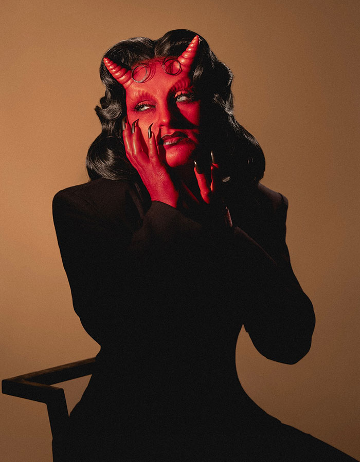 Celebrity with red devil Halloween costume and black outfit, showcasing creative Halloween costumes by celebrities this year.