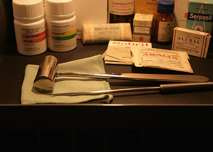 Old medical tools and bottles displayed on a table, illustrating some of the most terrifying things found online.