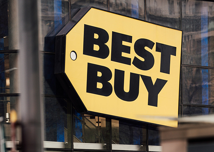 Yellow Best Buy store sign on glass building, illustrating horrible gifts people have actually received stories.