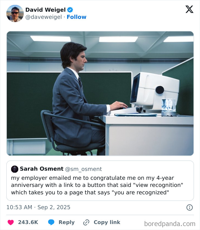Man in a suit working at a vintage computer in an office cubicle, illustrating tweets about having a job.
