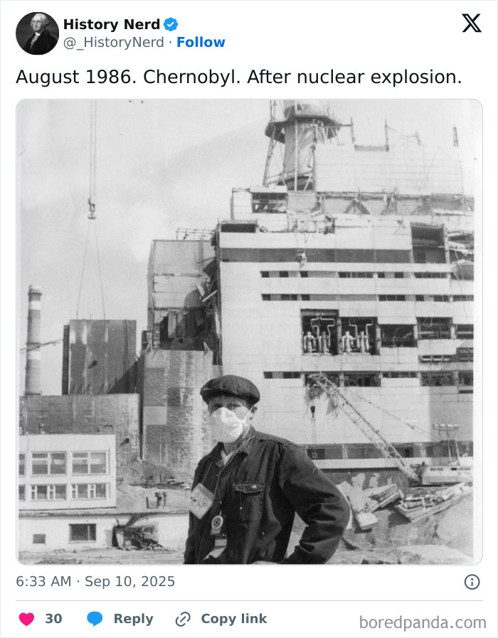 Man wearing a mask stands in front of damaged nuclear power plant, powerful rare photo exploring history of Chernobyl disaster.