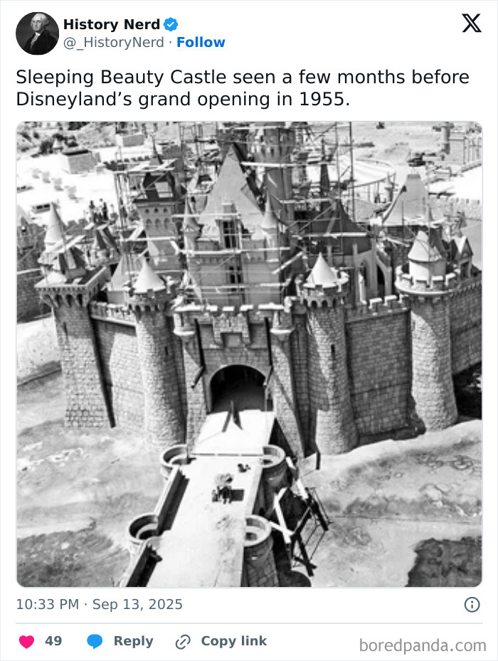 Black and white photo of Sleeping Beauty Castle under construction before Disneyland’s 1955 grand opening, exploring history.