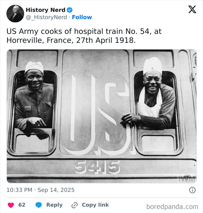 Two US Army cooks smiling from windows of hospital train No. 54 in France during World War I, rare history photo.