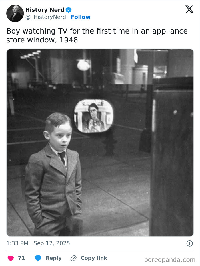 Boy watching TV for the first time in appliance store window, a rare and powerful moment in history captured in 1948.