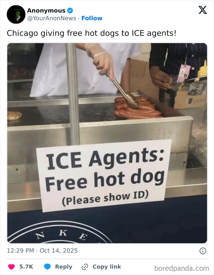 Sign offering free hot dogs to ICE agents with a person cooking hot dogs behind the counter in a fail attempt.