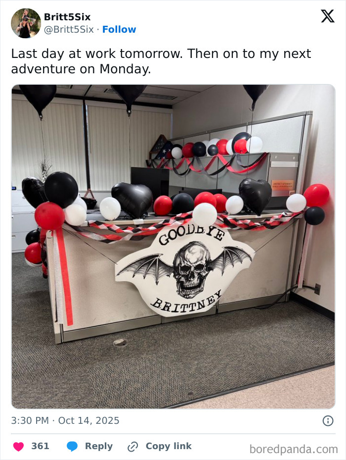 Office cubicle decorated with black, red, and white balloons and a skull sign saying goodbye as part of employee prank goodbye joke.