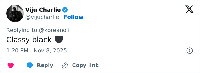 Screenshot of a tweet replying with classy black heart emoji amid Millie Bobby Brown natural breasts defense debate.
