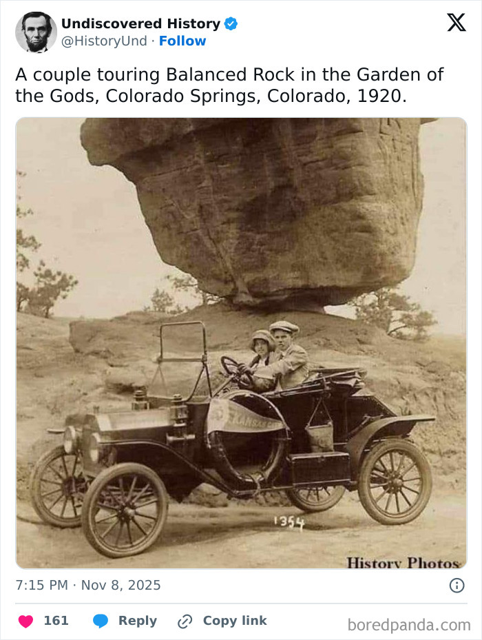 Vintage photo of a couple touring Balanced Rock in Colorado Springs, capturing moments lost to time from 1920.