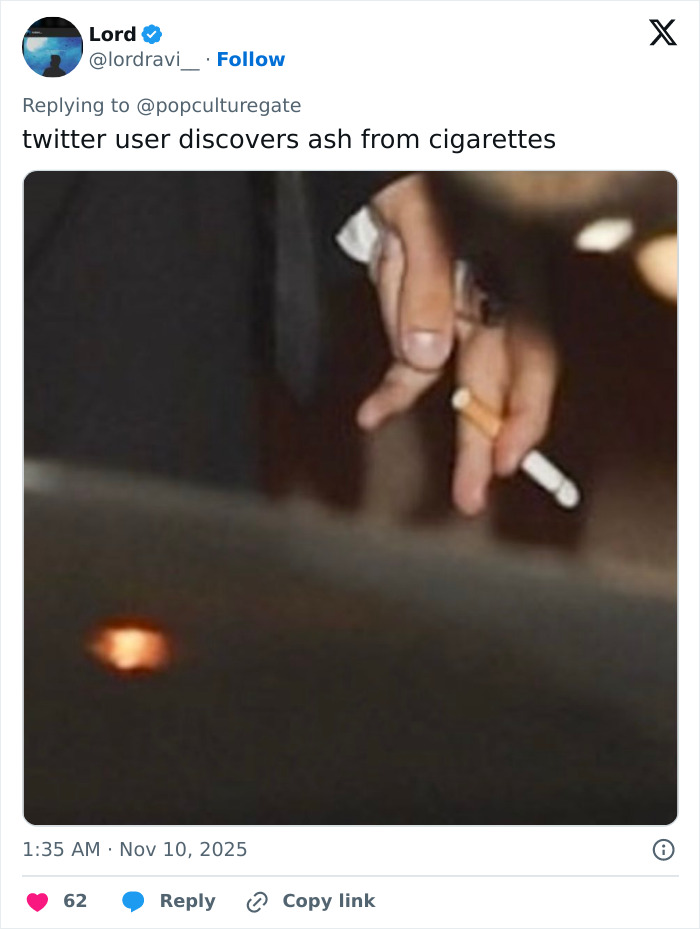 Hand holding a lit cigarette with ash falling, highlighting concern for Justin Bieber after fans notice something on his c****h. Hand holding a lit cigarette with ash falling, highlighting concern for Justin Bieber after fans notice something on his c****h.