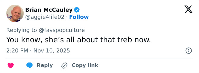 Screenshot of a Twitter reply joking about Meghan Trainor's new look, mentioning bass and treb in a fan reaction.