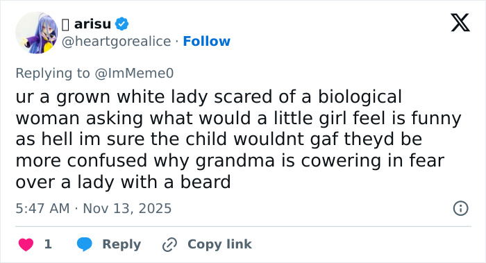 Screenshot of a social media reply discussing a woman upset about a bearded trans man in a women&rsquo;s restroom debate.