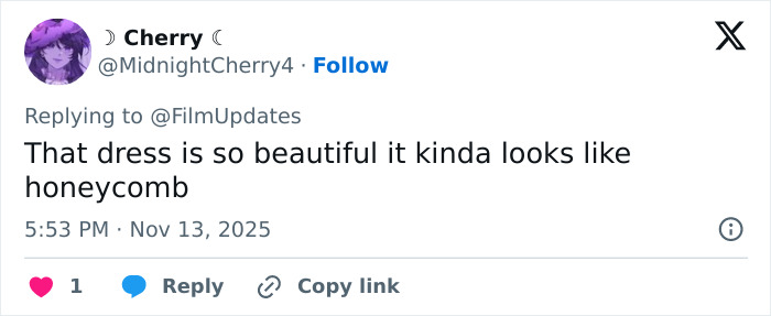 Twitter user commenting on Michelle Yeoh&rsquo;s wasp nest inspired outfit at a premiere, sparking an online meltdown.